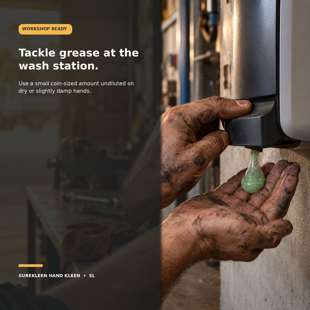 Greasy mechanic hands dispensing green industrial hand cleaner in a workshop
