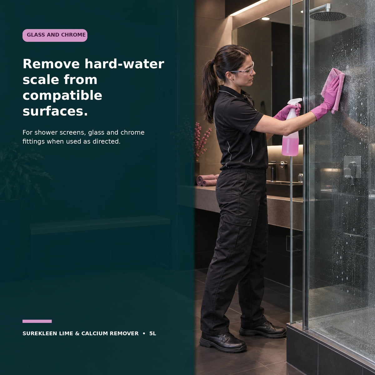 Gloved professional cleaner removing hard-water scale from a glass shower screen
