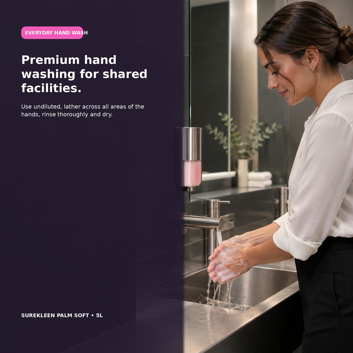 Worker washing hands with liquid soap in a modern commercial washroom

