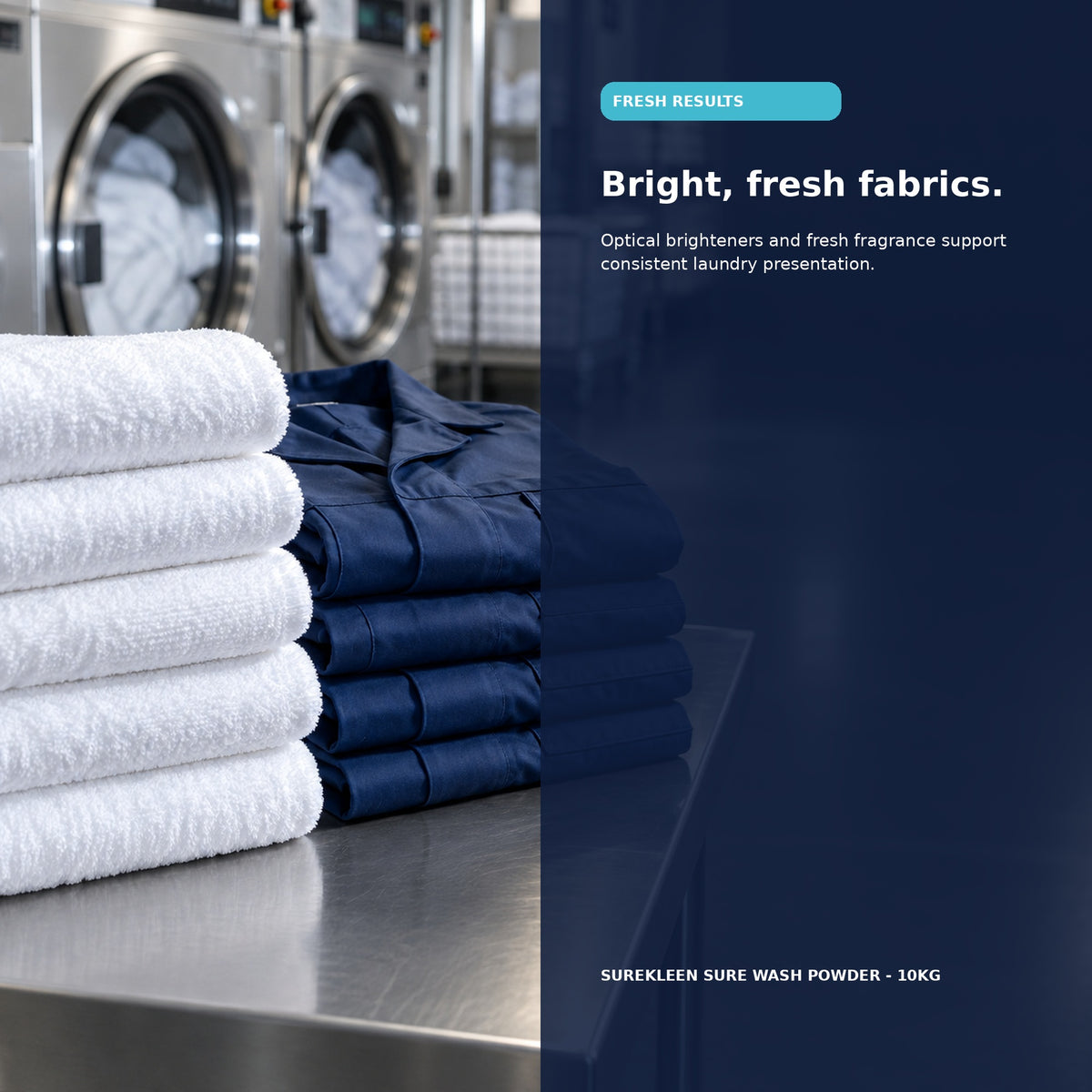 Fresh folded white towels and navy workwear in a commercial laundry
