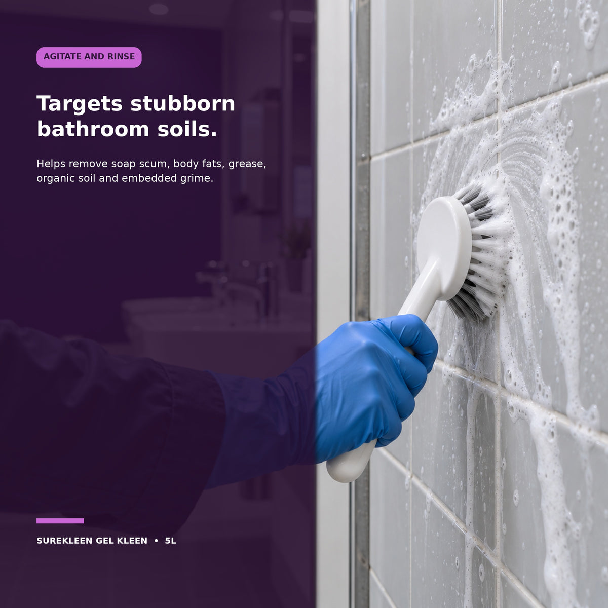 Gloved cleaner agitating foaming gel on bathroom tiles and grout
