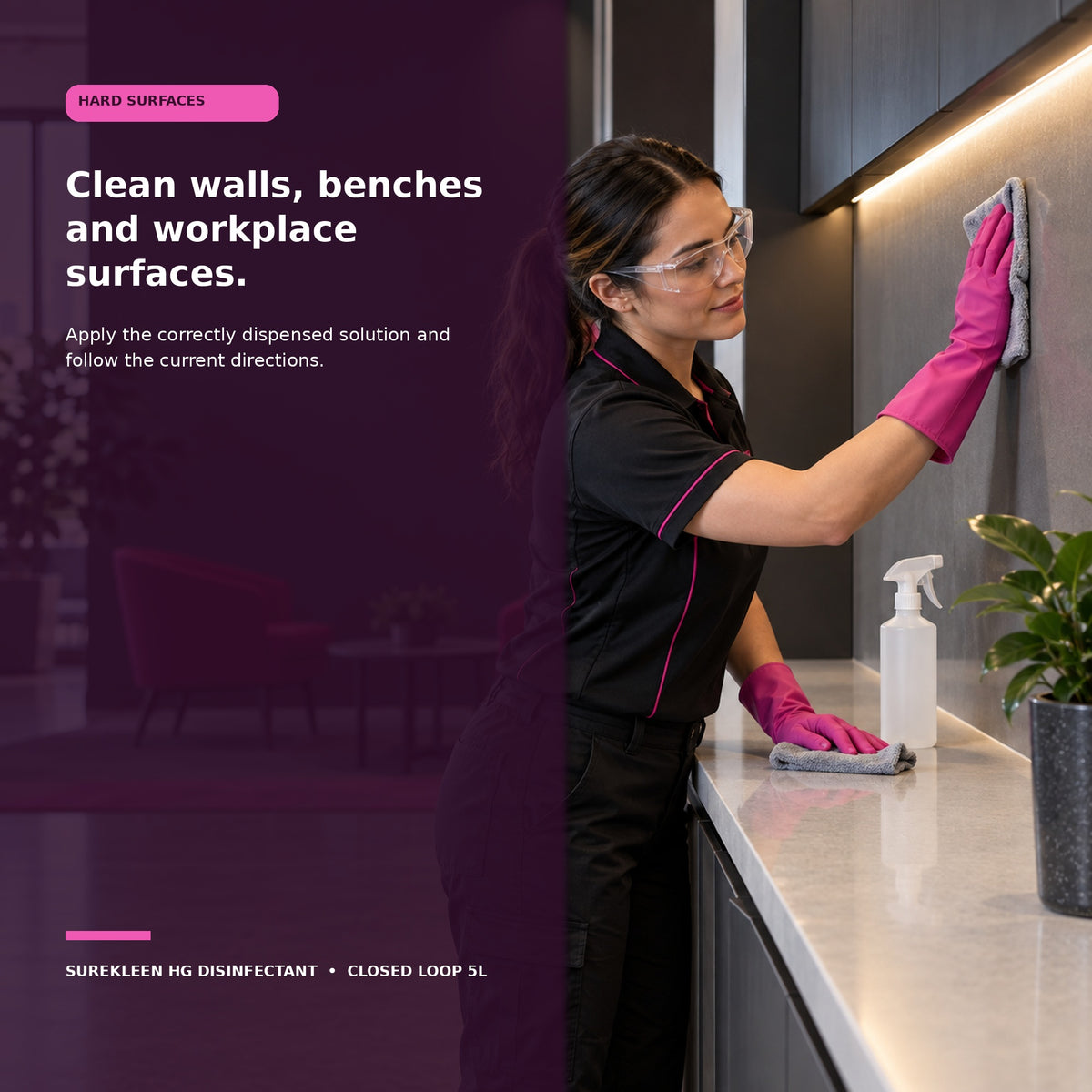 Professional cleaner wiping a commercial wall and benchtop hard surface
